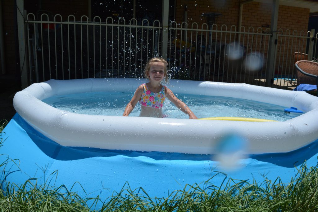 Five-year-old Jasmine O'Neil cools off from the summer heat.